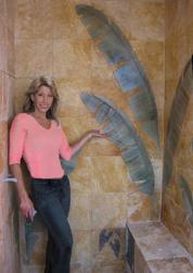 mural artist Janna Morrison with grand wall mural in san francisco